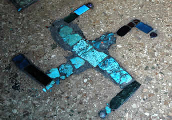 Turquoise swastika on the temple floor in a Tibetan Buddhist monastery